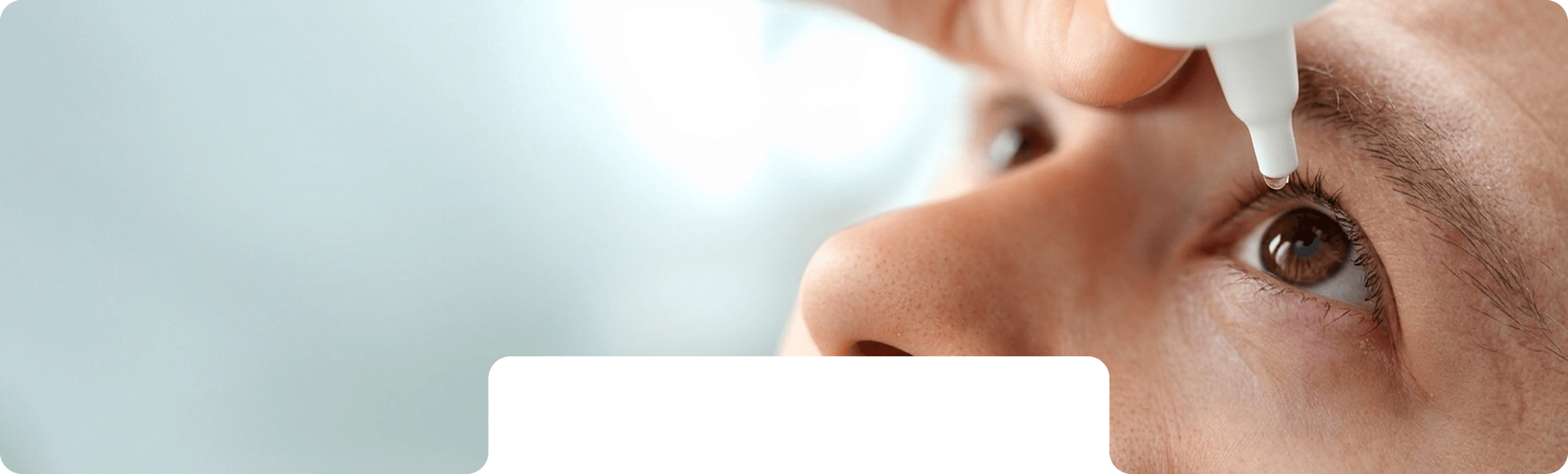 Eye drops being applied during squint care
